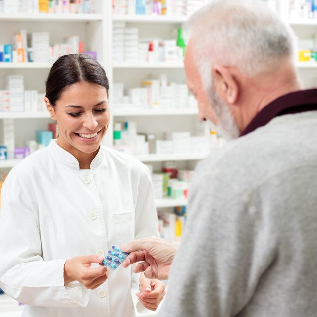 A pharmacist talking to a patient